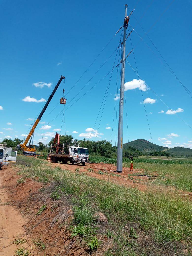 Overhead line crew with bucket truck