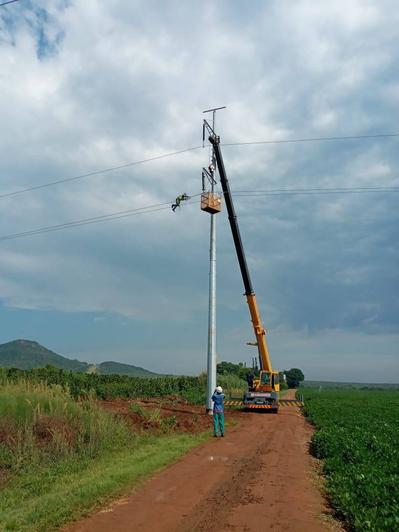 Crew preparing overhead line hardware