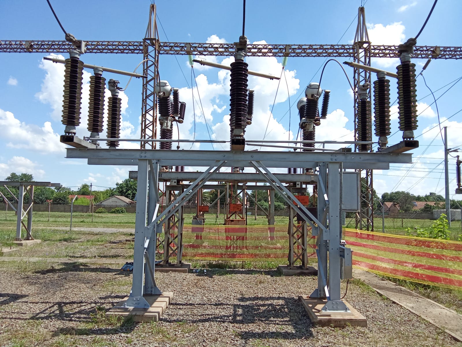 Outdoor HV switchyard looking toward overhead lines