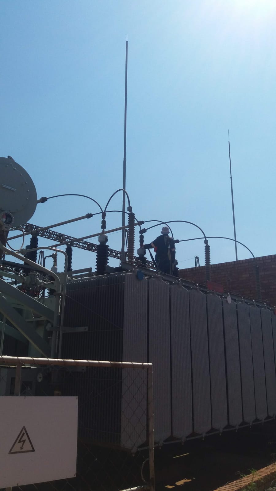 Technician working on a power transformer