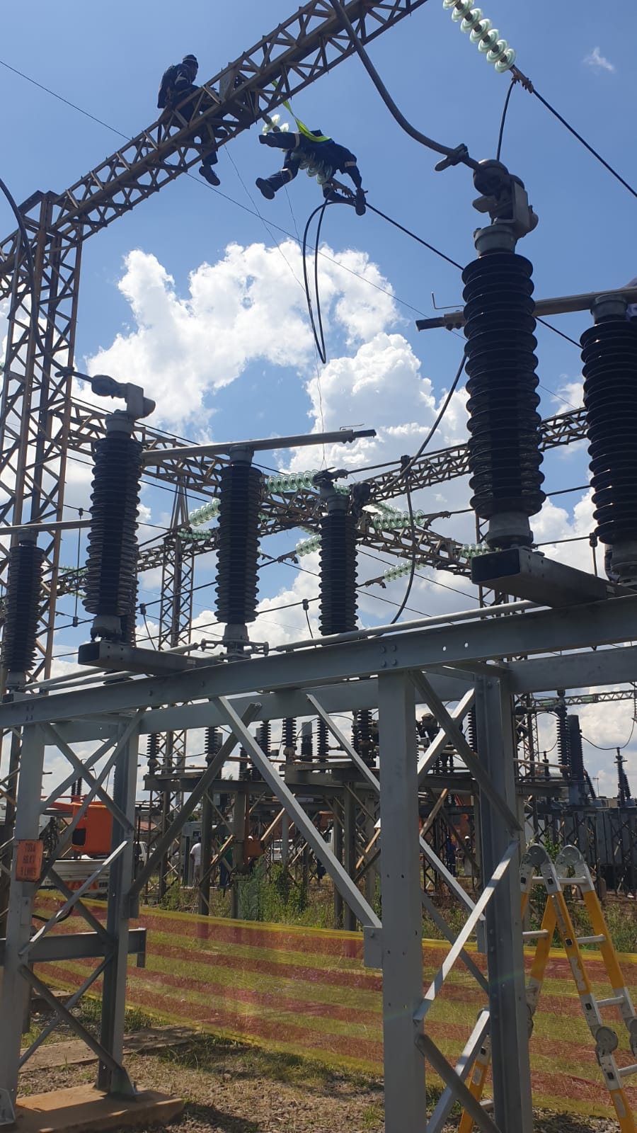 Crew working at height on substation equipment