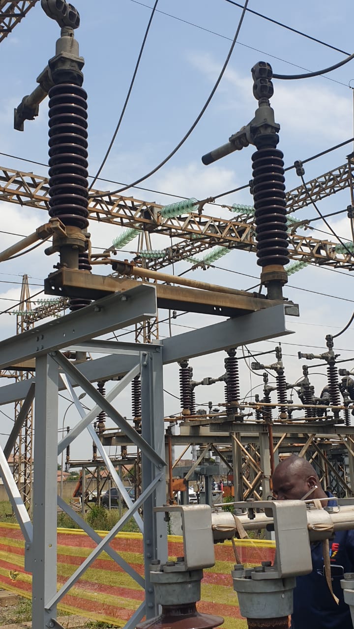 Outdoor substation works under a clear sky