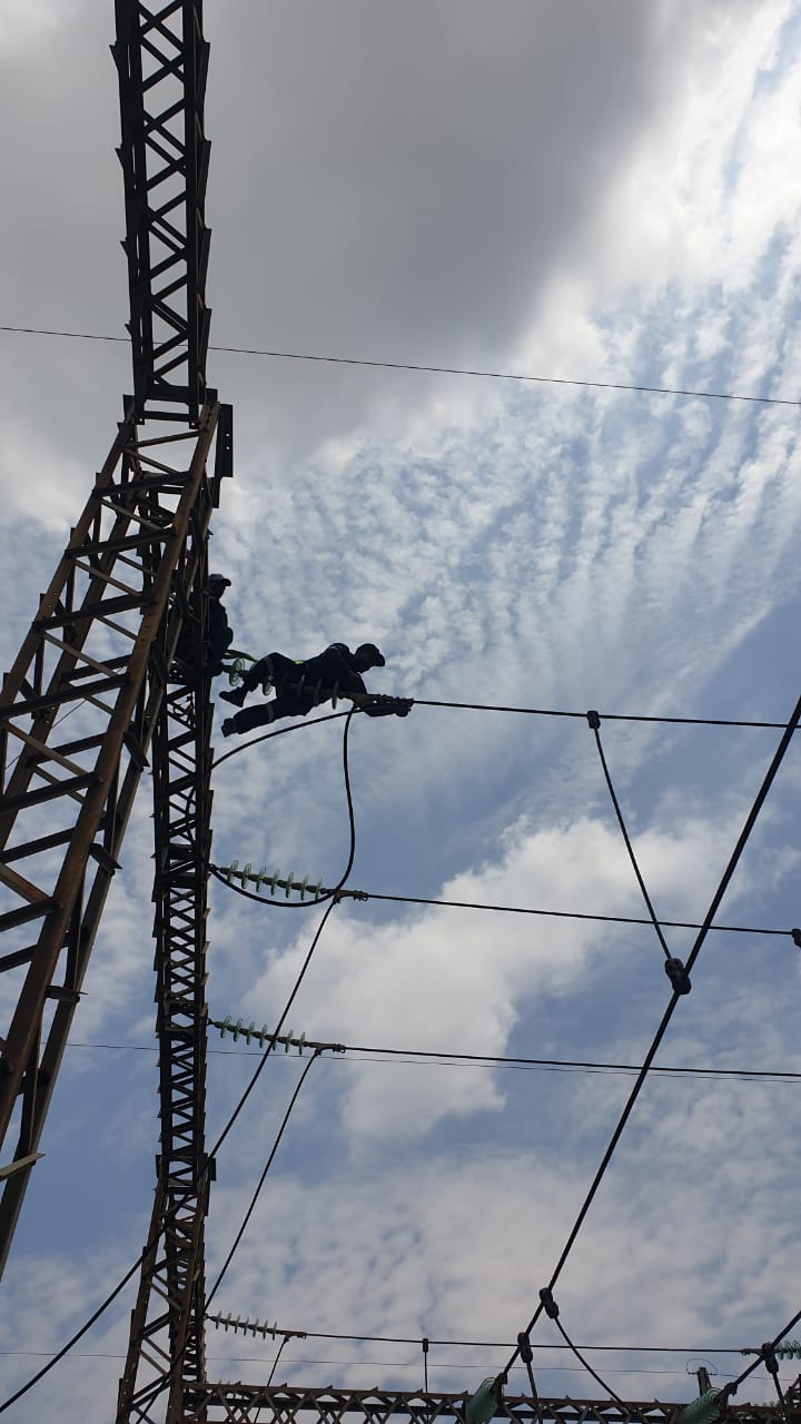 High-level cable work on the substation gantry